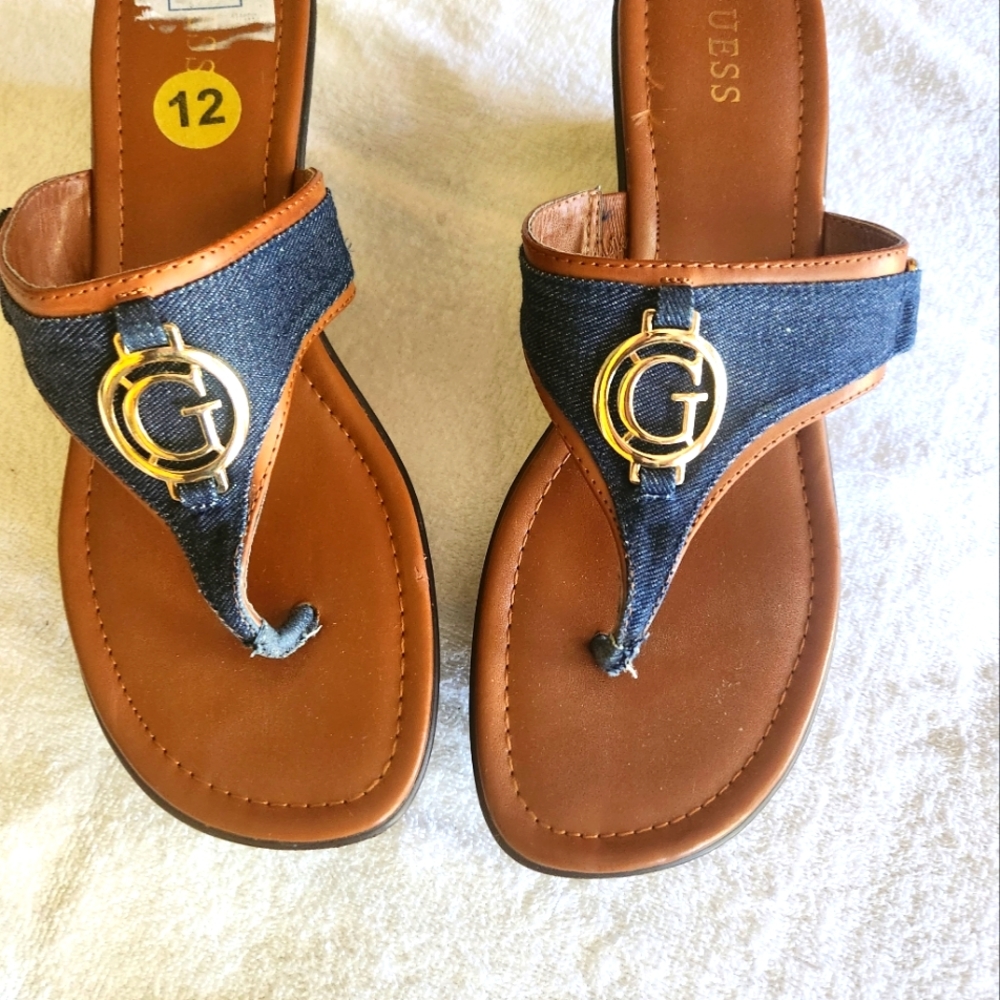 Guess women's 2.5 inch slip-on denim signature gold wedged emblem sandal.
